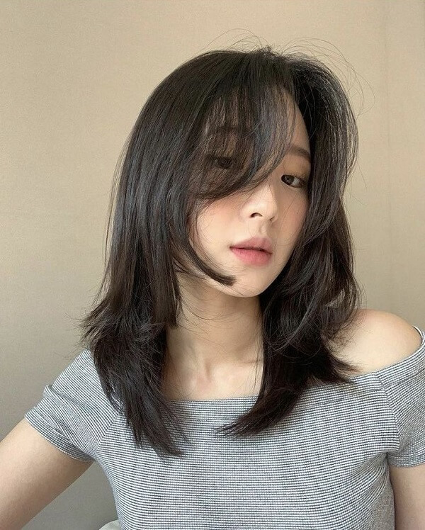 Tóc layer xoăn sóng nước ngang vai